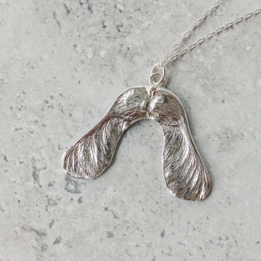 Handmade silver sycamore seed necklace