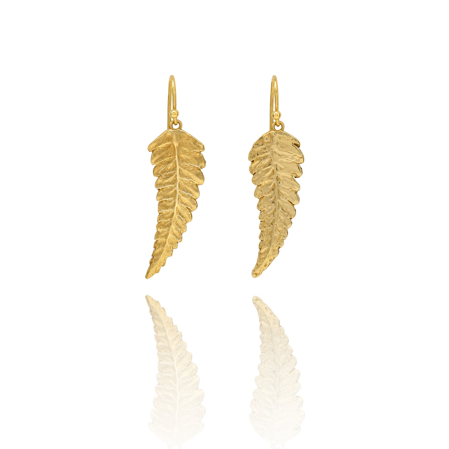 Handmade recycled gold fern leaf drop earrings by Iris and Lolli on white background, nature inspired and crafted in the UK