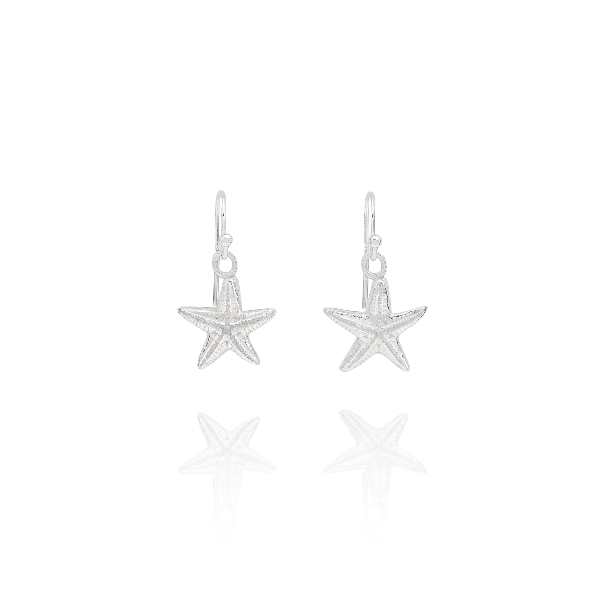 Handmade recycled silver starfish earrings by Iris and Lolli, ocean inspired jewellery crafted in the UK on white background