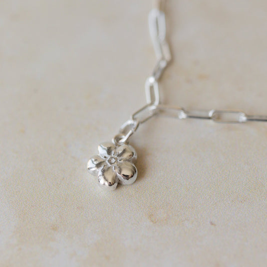 silver forget me not flower charm bracelet with delicate paperclip chain, handcrafted floral charm jewellery by Iris & Lolli