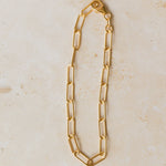18ct gold vermeil chunky paperclip chain bracelet displayed on neutral background by Iris & Lolli