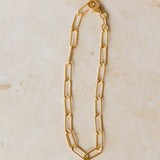 18ct gold vermeil chunky paperclip chain bracelet displayed on neutral background by Iris & Lolli