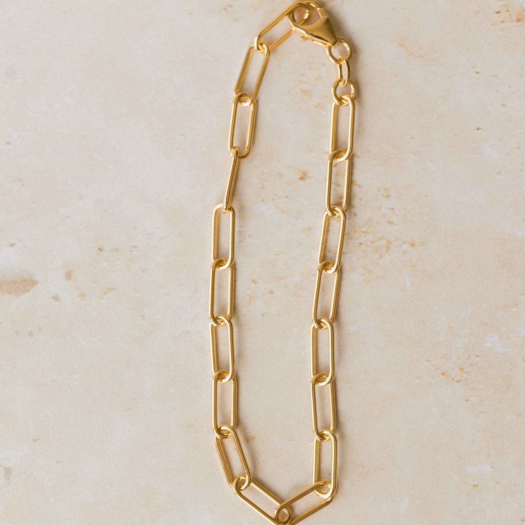 18ct gold vermeil chunky paperclip chain bracelet displayed on neutral background by Iris & Lolli