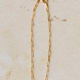 18ct gold vermeil fine paperclip chain bracelet displayed on neutral background by Iris & Lolli