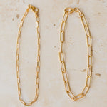 18ct gold vermeil paperclip chain bracelets in thin and chunky link styles on neutral background by Iris & Lolli