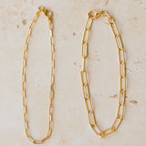 18ct gold vermeil paperclip chain bracelets in thin and chunky link styles on neutral background by Iris & Lolli