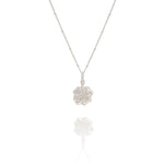 Silver necklace with a leaf pendant on a white background