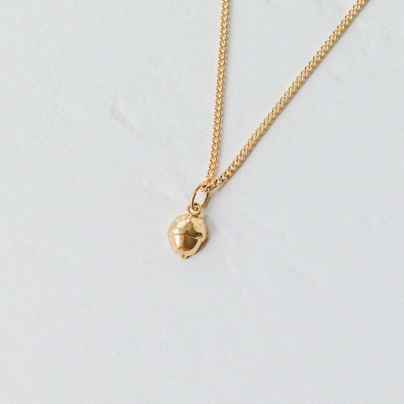 Model wearing Gold Baby Acorn Earrings & Necklace Set (4)