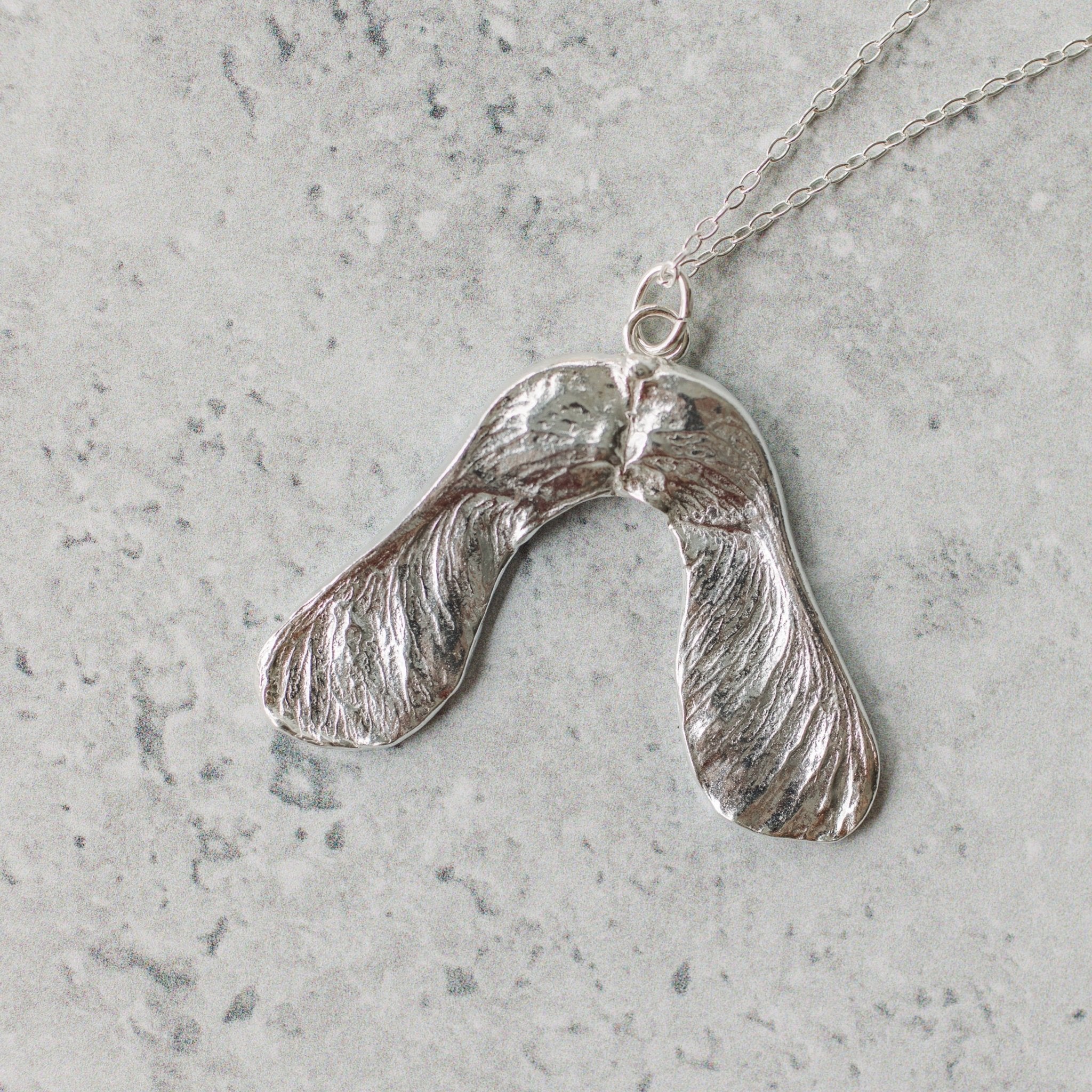 Handmade silver sycamore seed necklace