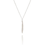 Silver necklace with a leaf pendant on a white background
