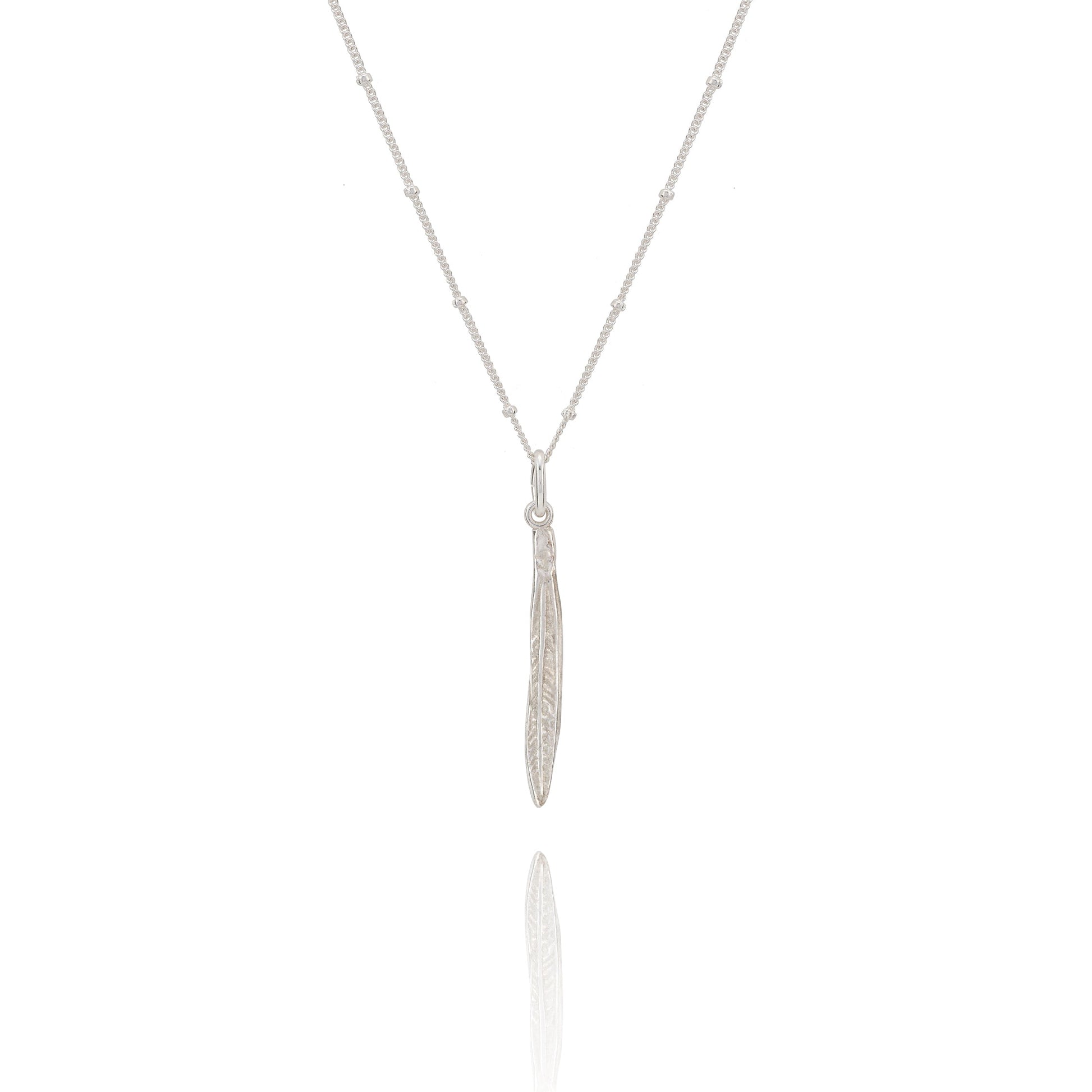 Silver necklace with a leaf pendant on a white background