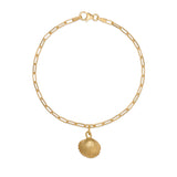 gold cockle shell charm bracelet with fine paperclip chain on white background, ocean-inspired jewellery handcrafted by Iris & Lolli