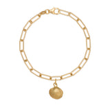 gold cockle shell charm bracelet with paperclip chain on white background, handcrafted coastal charm design by Iris & Lolli
