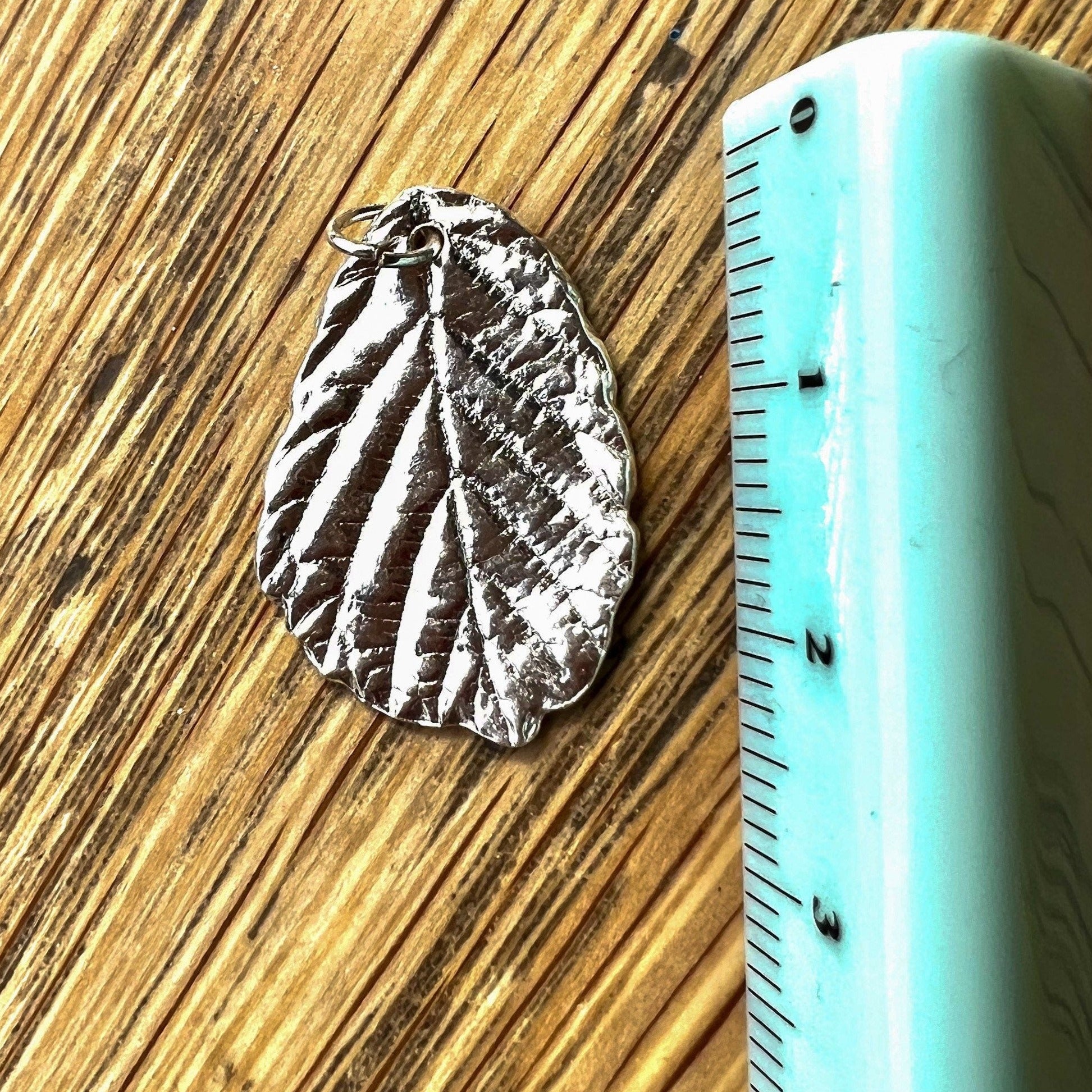 Silver blackberry leaf necklace pendant, cast from a real leaf in recycled silver.