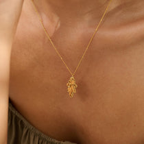 Model wearing Midi Gold Oak Leaf Necklace (1)