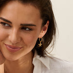 Model wearing Iris & Lolli Gold Statement Limpet Necklace paired with Gold Cockle Shell Charm Bracelet and Gold Starfish Hoop Earrings, all handcrafted from recycled silver with 18ct gold vermeil finish