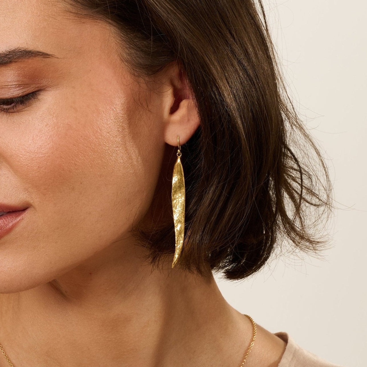 Model wearing Iris & Lolli Willow Leaf Necklace and matching gold vermeil earrings inspired by natural leaf forms