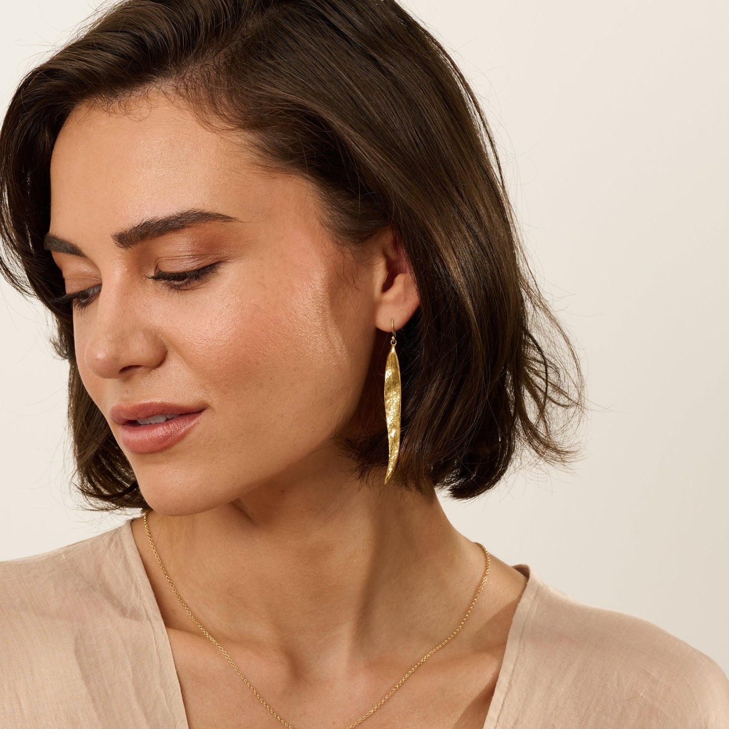 Model wearing Iris & Lolli Willow Leaf Necklace and matching gold vermeil earrings inspired by natural leaf forms