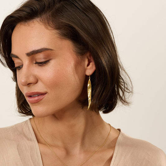 Model wearing Iris & Lolli Willow Leaf Necklace and matching gold vermeil earrings inspired by natural leaf forms