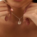 Model wearing Iris & Lolli Silver Four Leaf Clover Necklace with matching Silver Four Leaf Clover Drop Earrings handcrafted from recycled silver