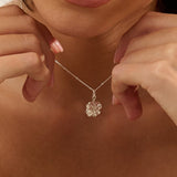 Model wearing Iris & Lolli Silver Four Leaf Clover Necklace with matching Silver Four Leaf Clover Drop Earrings handcrafted from recycled silver