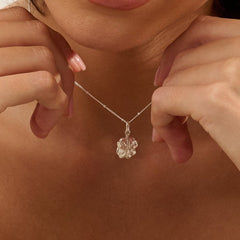 Model wearing Iris & Lolli Silver Four Leaf Clover Necklace with matching Silver Four Leaf Clover Drop Earrings handcrafted from recycled silver