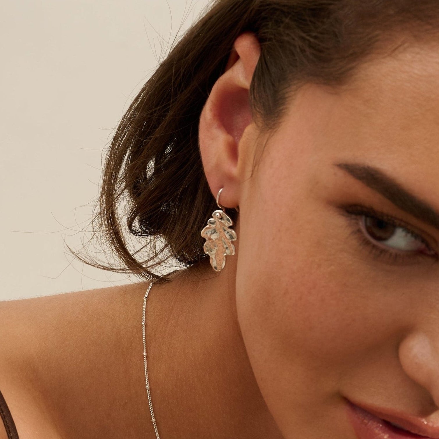Model wearing Iris & Lolli Silver Oak Leaf Necklace with matching Silver Oak Leaf Drop Earrings handcrafted from recycled silver