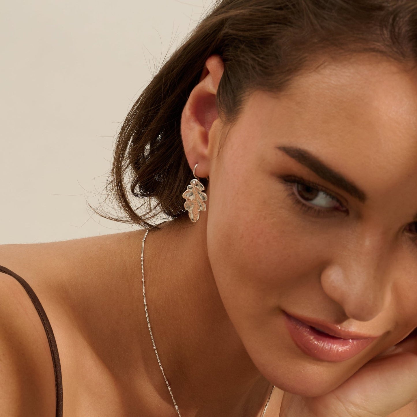 Model wearing Iris & Lolli Silver Oak Leaf Necklace with matching Silver Oak Leaf Drop Earrings handcrafted from recycled silver