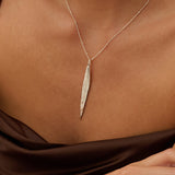 Model wearing Iris & Lolli Silver Willow Leaf Necklace with matching Silver Willow Leaf Drop Earrings handcrafted from recycled silver