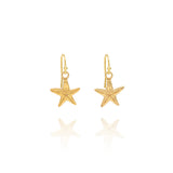 Handmade recycled gold starfish drop earrings by Iris and Lolli on white background, coastal inspired and crafted in the UK