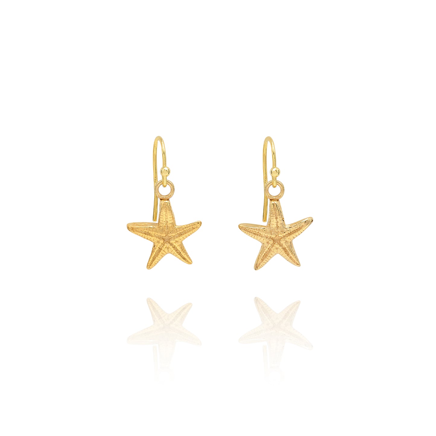 Handmade recycled gold starfish drop earrings by Iris and Lolli on white background, coastal inspired and crafted in the UK
