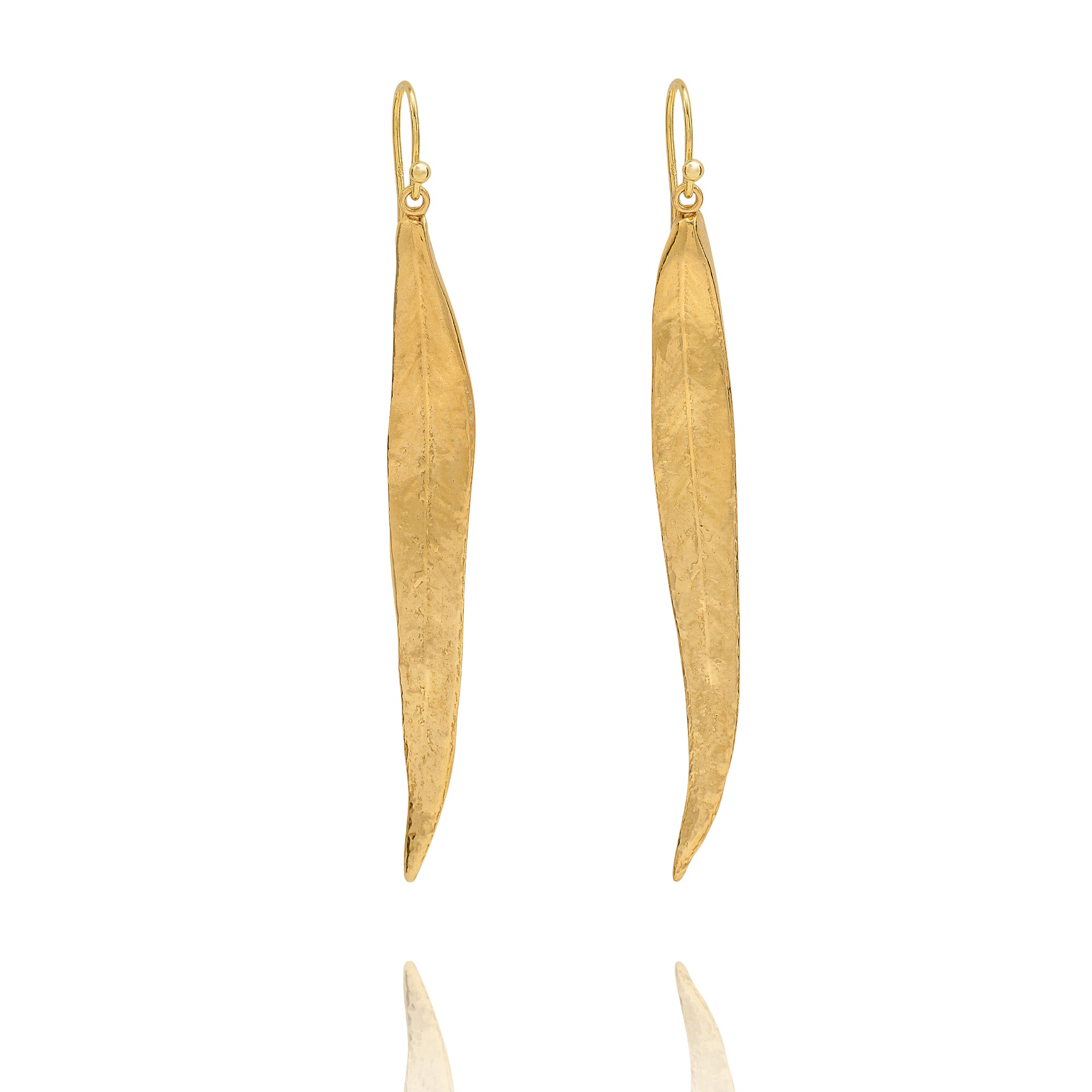 Handmade recycled gold long willow leaf drop earrings by Iris and Lolli on white background, nature inspired and crafted in the UK