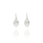 Handmade recycled silver acorn drop earrings by Iris and Lolli on white background, woodland inspired and crafted in the UK