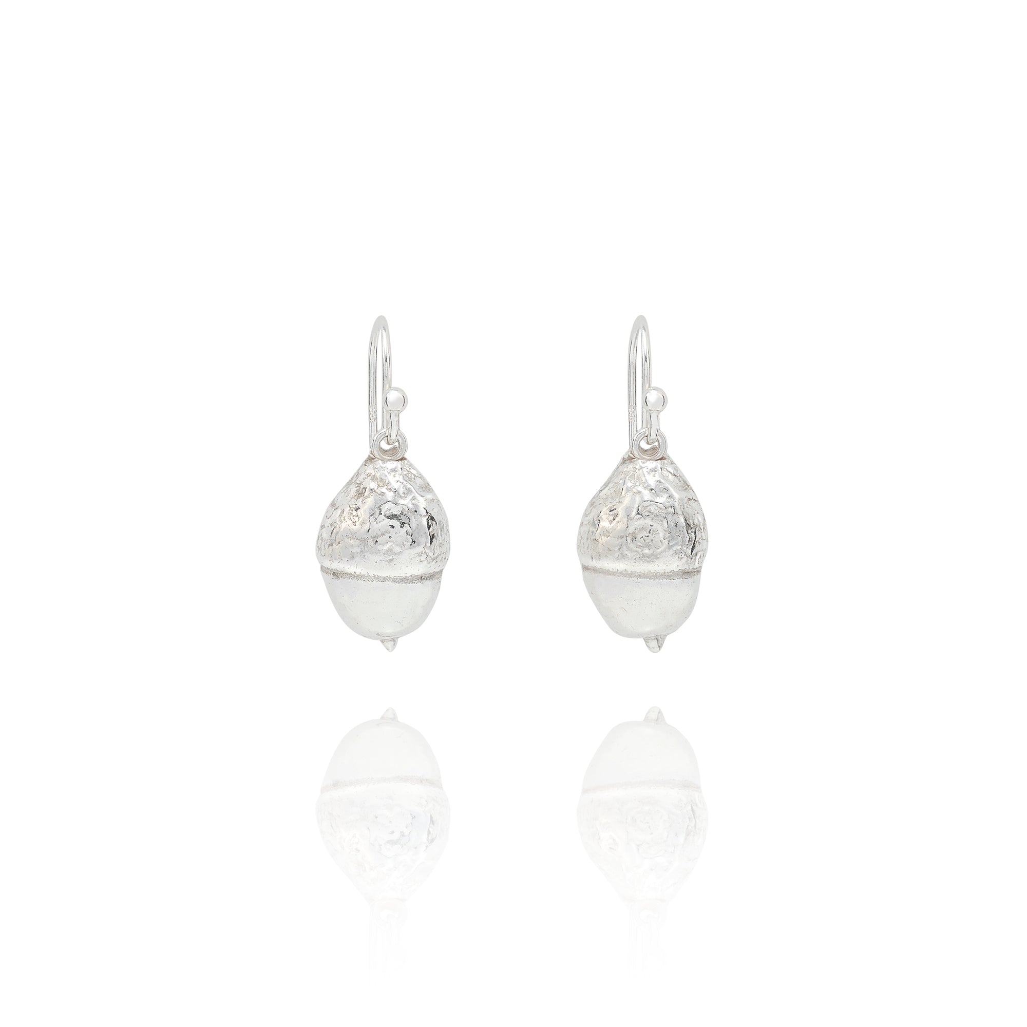 Handmade recycled silver acorn drop earrings by Iris and Lolli on white background, woodland inspired and crafted in the UK