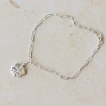 recycled silver four-leaf clover bracelet with paperclip chain displayed on neutral background by Iris & Lolli
