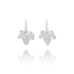 Handmade recycled silver ivy leaf drop earrings by Iris and Lolli on white background, nature inspired and crafted in the UK
