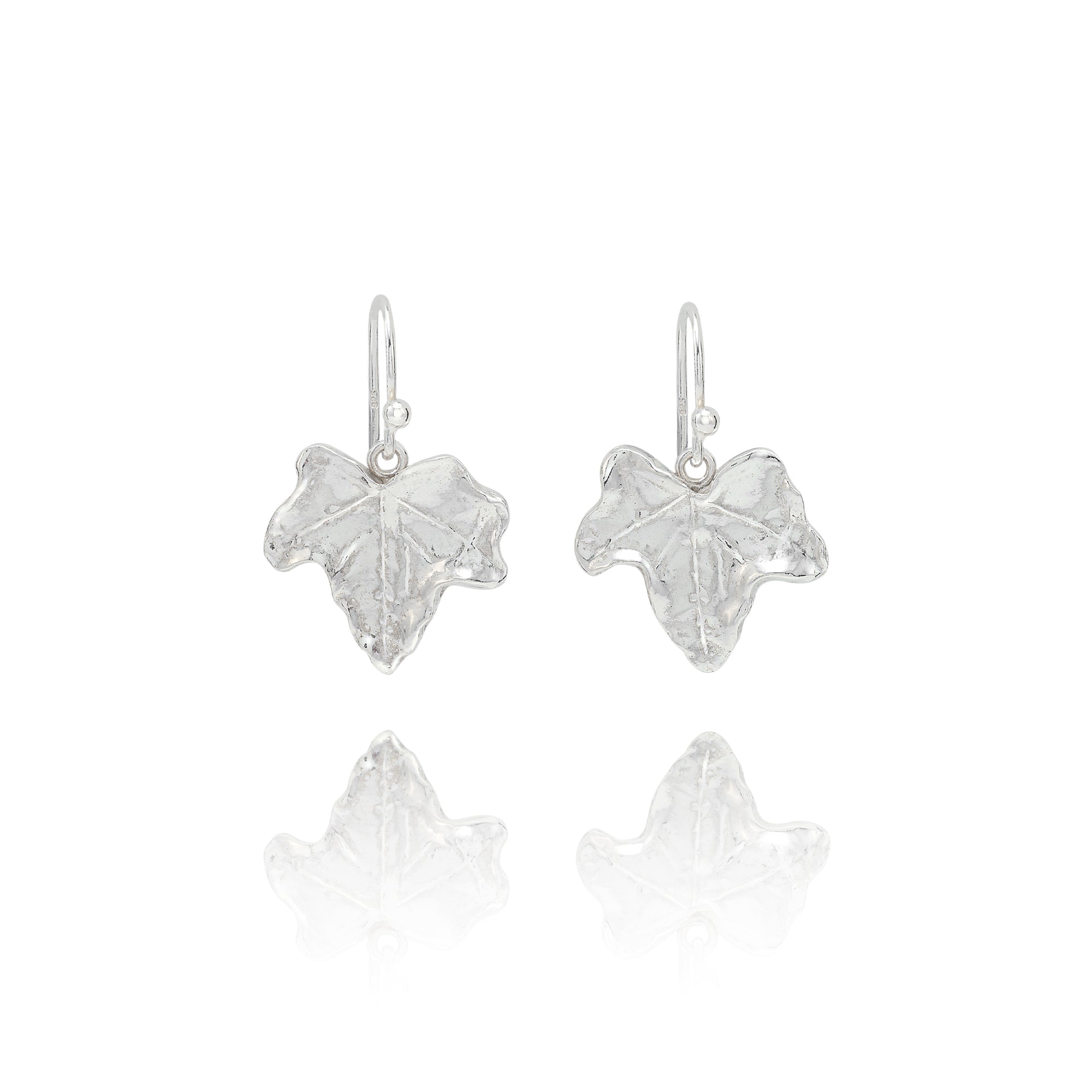 Handmade recycled silver ivy leaf drop earrings by Iris and Lolli on white background, nature inspired and crafted in the UK