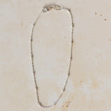 recycled silver satellite chain bracelet with delicate bead accents displayed on neutral background by Iris & Lolli