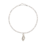 recycled silver whelk shell charm bracelet with fine paperclip chain on white background by Iris & Lolli