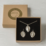 Silver baby rose leaf necklace and matching earrings presented together in a gift box