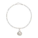 recycled silver cockle shell charm bracelet with fine paperclip chain on white background, sustainable coastal jewellery by Iris & Lolli