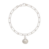 recycled silver cockle shell charm bracelet with paperclip chain on white background, handcrafted coastal jewellery by Iris & Lolli