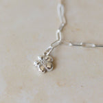 silver forget me not flower charm bracelet with delicate paperclip chain, handcrafted floral charm jewellery by Iris & Lolli