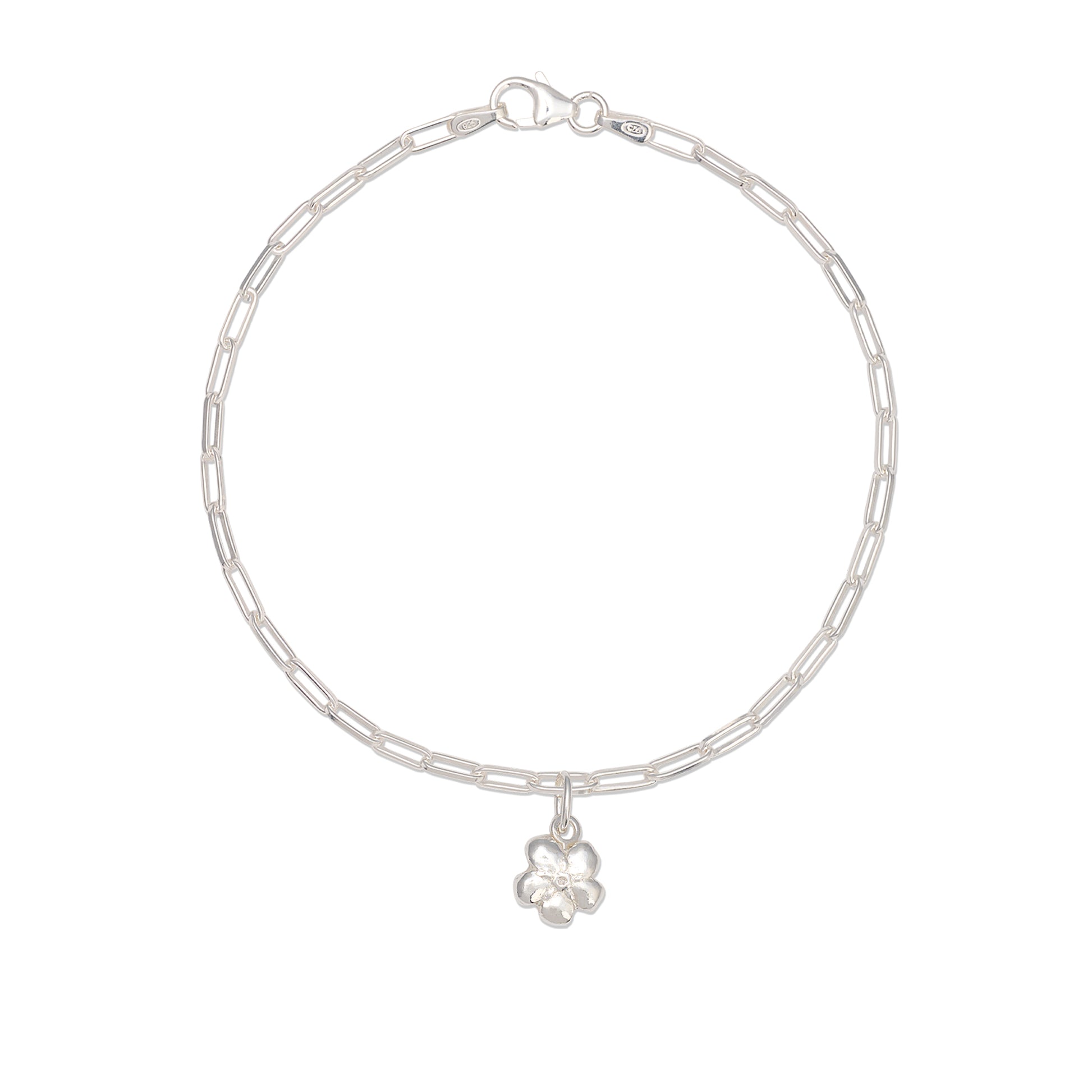 silver forget me not flower charm bracelet on white background with delicate paperclip chain, handcrafted floral bracelet by Iris & Lolli