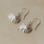 Handmade recycled silver limpet shell drop earrings inspired by the sea, crafted in the UK by Iris and Lolli