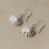 Handmade recycled silver limpet shell drop earrings inspired by the sea, crafted in the UK by Iris and Lolli