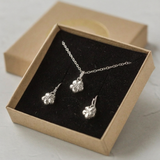 Handmade silver forget me not flower necklace and earring gift set presented in eco-friendly packaging
