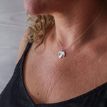 Handmade silver ivy leaf necklace worn on model, artisan botanical silver jewellery UK, eco friendly meaningful necklace